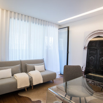 Living Room with Antique Door, Glass Desk and Sofa