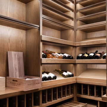 Modern Glass-Enclosed Wine Cellar with Custom Oak Racking | Chicago