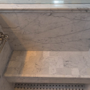 Traditional Carrara Marble Primary Bath Refresh With Maple VanityThe homeowners