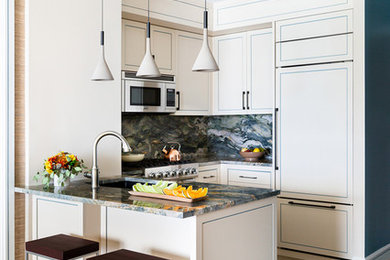 Example of a small transitional u-shaped limestone floor and beige floor kitchen design in New York with an undermount sink, quartzite countertops, multicolored backsplash, stone slab backsplash, paneled appliances, multicolored countertops, recessed-panel cabinets, beige cabinets and a peninsula