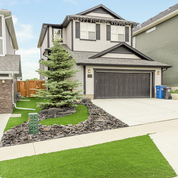 Low Maintenance Front Yard with Synthetic Grass & Rundle Rocks