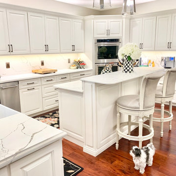 Ivory White Kitchen With Marble Look Quartz Counters and Splash