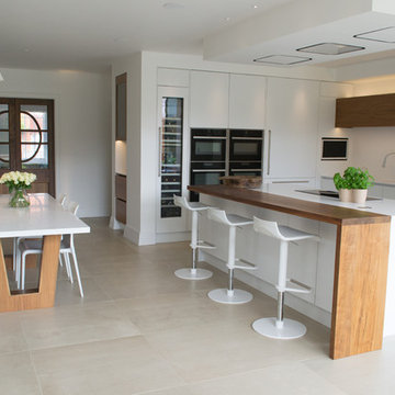 White Kitchen with Walnut breakfast bar and features