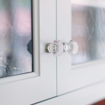 Antiqued glass and crystal knobs on dish dresser