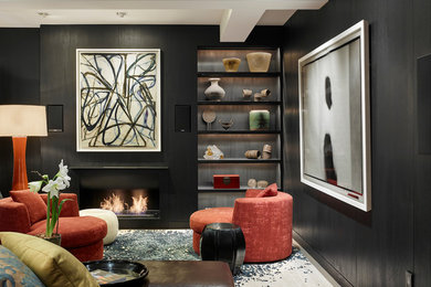 Inspiration for a mid-sized contemporary formal enclosed living room in New York with black walls, light hardwood floors, a ribbon fireplace, a metal fireplace surround and no tv.