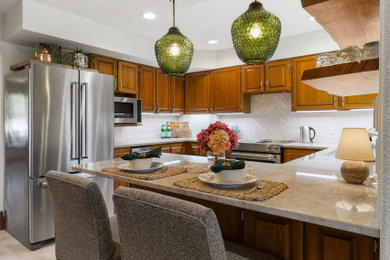 Eat-in kitchen - mid-sized transitional porcelain tile eat-in kitchen idea in Other with quartzite countertops and stainless steel appliances