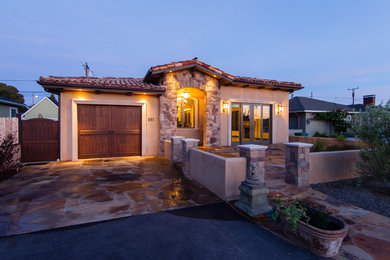 Mid-sized mediterranean beige one-story mixed siding gable roof idea in San Luis Obispo