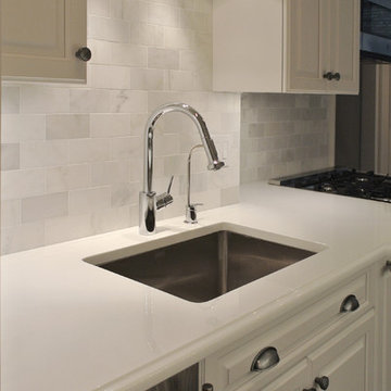 White Prewar Kitchen with Custom Cabinetry and Marble Backsplash