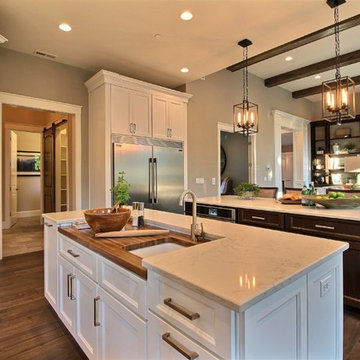 Kitchen w/ Views to the Walk-In Pantry + Mud Room + Powder Bath + Great Room