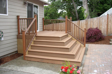 Small arts and crafts back porch photo in Seattle with decking
