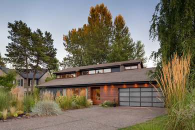Photo of a contemporary two-storey exterior in Portland.