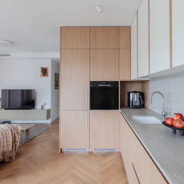 Minimalist Oak & Neolith worktop Kitchen with Spray-Painted MDF upper cabinets
