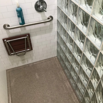 Glass Block Shower with a Solid Surface Base and Shower Wall Panels California
