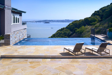Design ideas for a traditional infinity pool in San Francisco with a water feature.
