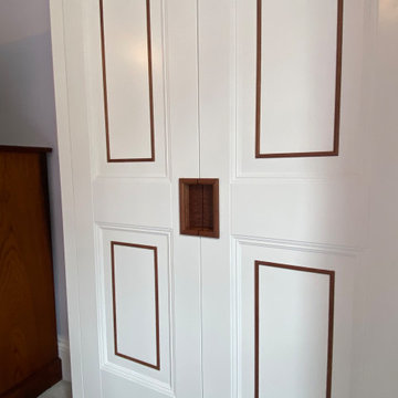 Bespoke Fitted Wardrobes with Painted Panelled Doors and Wood Inlay | Cheltenham