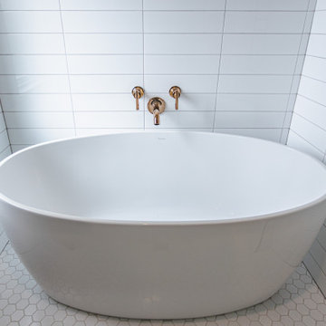 Bathroom remodeling in Arlington, VA with double vanity & corner bathtub