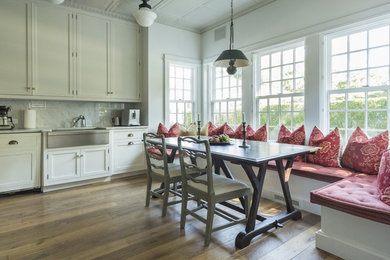 Example of a medium tone wood floor kitchen design in New York
