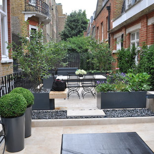 Small contemporary terrace and balcony in London with a pergola.