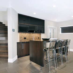 Contemporary basement in Calgary with grey walls and porcelain flooring.