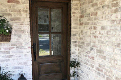 Inspiration for a farmhouse entryway remodel in Houston