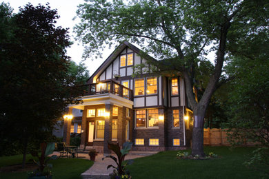 Example of a large classic home design design in Chicago