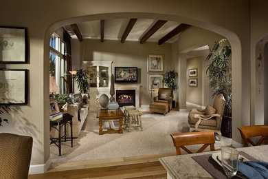 Mid-sized elegant carpeted living room photo in San Francisco with brown walls, a standard fireplace and a wall-mounted tv