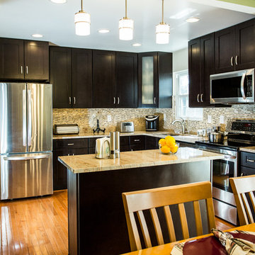 Espresso Kitchen Remodel with Granite Island and Stainless Steel Appliances