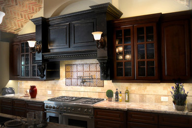 Inspiration for a country kitchen in Houston with louvered cabinets, dark wood cabinets, granite benchtops, yellow splashback and stainless steel appliances.