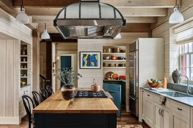 Large country galley kitchen photo in Burlington with an island