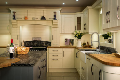 Large traditional u-shaped eat-in kitchen in Dublin with shaker cabinets.