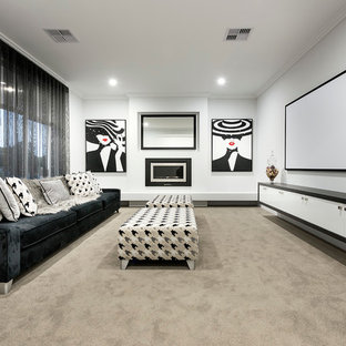 Mid-sized trendy open concept carpeted home theater photo in Perth with white walls and a projector screen