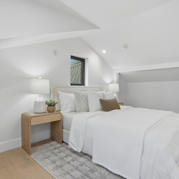 Loft Bedroom in Modern ADU with Sloped Ceiling