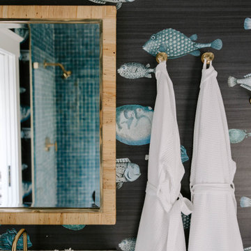 Luxury Bathroom with Fish Wallpaper & Brass Fixtures