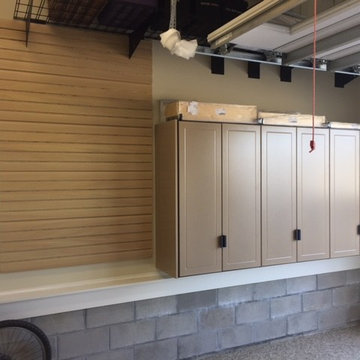 Deep, single wide garage features work bench and exercise area