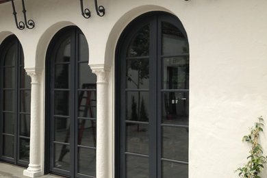 Large elegant entryway photo in Portland with a dark wood front door