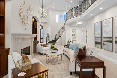 Living room - huge coastal formal and open concept travertine floor, beige floor and vaulted ceiling living room idea in San Diego with white walls, a plaster fireplace and no tv