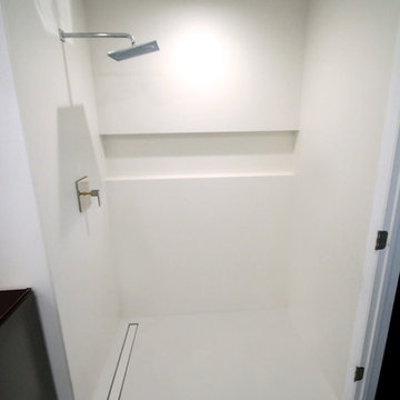 Minimalist White Bathroom - Neolith XL Porcelain tile slab/panel shower w niche
