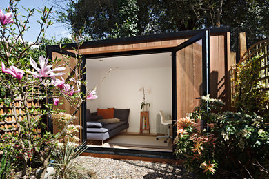 Photo of a contemporary garden shed and building in London.