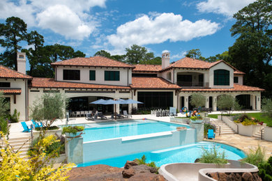 Inspiration for a huge mediterranean custom-shaped aboveground pool landscaping remodel in Houston