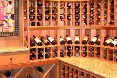 Mid-sized country wine cellar in Atlanta with display racks.