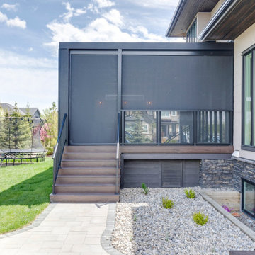 Adjustable StruXure Pergola Featuring Outdoor Kitchen With Screens & Heaters