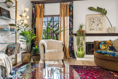 Example of a mid-sized eclectic open concept living room design in Los Angeles with multicolored walls and a tv stand