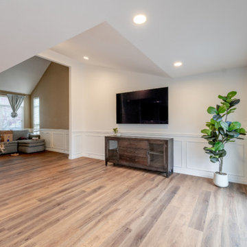 Modern Great Room with Vaulted Ceilings and Custom Wall Molding