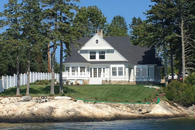 Elegant gray two-story wood gable roof photo in Portland Maine