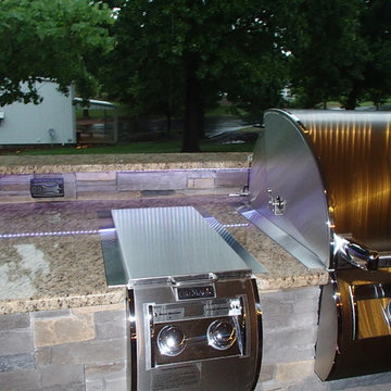 L Shaped Outdoor Kitchen With Unique Lighting