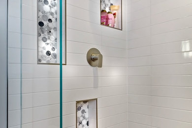 Example of a mid-sized trendy master multicolored tile and porcelain tile porcelain tile bathroom design in Minneapolis with a trough sink, flat-panel cabinets, light wood cabinets, solid surface countertops and white walls