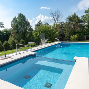 Burr Ridge Lap Pool with Raised Hot Tub and Waterfall