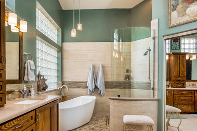 Inspiration for a large transitional master beige tile and porcelain tile porcelain tile and beige floor bathroom remodel in Phoenix with shaker cabinets, dark wood cabinets, a two-piece toilet, green walls, an undermount sink and quartz countertops
