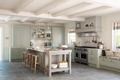 Inspiration for a large contemporary l-shaped kitchen in Other with shaker cabinets, green cabinets, metro tiled splashback, stainless steel appliances and an island.