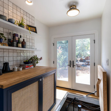 Basement Access in Kitchen through Hatch Door to Spiral Staircase